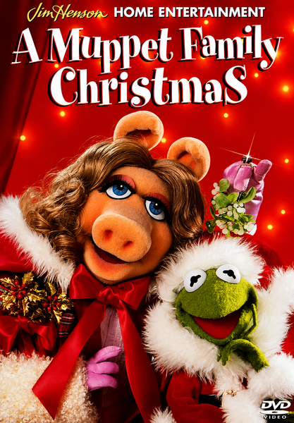 Miss Piggy and Kermit the Frog, dressed in festive holiday outfits, smile in front of a red background adorned with Christmas lights. Text reads: Jim Henson Home Entertainment - A Muppet Family Christmas. This cheerful scene is perfect for fans and collectors looking to add “A Muppet Family Christmas DVD (1987)”—a rare classic—to their holiday movie collection.