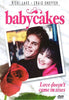 A smiling man and woman lean together beside a red rose on a white surface. Text reads “babycakes” and “Love doesn’t come in sizes,” with “Ricki Lake” and “Craig Sheffer” featured above the title. The Babycakes DVD (1989) is a heartwarming gem among classic movies on DVD, perfect for fans seeking hard-to-find films.