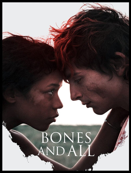 Two young people with dirt-smudged faces gaze into each other’s eyes, foreheads nearly touching. The text Bones and All (2022) DVD appears at the bottom, highlighting this haunting horror romance starring Timothée Chalamet.