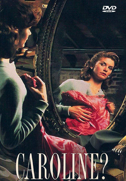 A woman sits holding a pink dress, gazing pensively into a large ornate mirror where her reflection is visible. The words “Caroline? DVD (1990)” appear in bold at the bottom—an evocative scene reminiscent of hard-to-find and classic movies on DVD that are cherished by collectors.