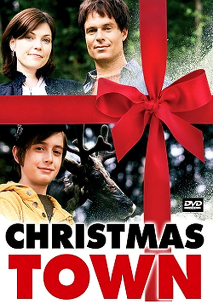 DVD cover of Christmas Town (2008) DVD featuring a woman, a man, and a boy standing in front of a reindeer, all framed by a large red ribbon and bow. Ideal for collectors of classic movies on DVD, the bold movie title “Christmas Town (2008)” is displayed at the bottom.