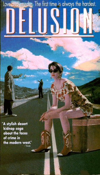 A woman in sunglasses and cowboy boots sits on a box on a desert road, with two men behind her—one pointing a gun at the other. Blue sky with clouds. Text: DELUSION, the cult thriller, now available on Delusion DVD (1999).