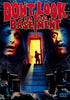 The Don’t Look in the Basement (1973) DVD poster features a frightened woman and a man's face on either side of a lit basement doorway with a silhouette inside, plus eerie cobwebs and rats for vintage horror effect.