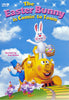 A cheerful animated Easter Bunny carrying eggs stands atop a bright yellow, smiling train with a conductor and three chickens beneath a blue, cloud-dotted sky. Designed in the charming Rankin/Bass stop-motion style, this delightful scene captures the nostalgic magic of classic films. Text reads: The Easter Bunny Is Coming To Town DVD (1977).