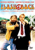 Two men stand in front of a train—one scruffy and cheerful, pointing ahead, the other clean-cut in a suit, looking serious. Psychedelic lettering spells out “Flashback” on the poster. Featuring Dennis Hopper and Kiefer Sutherland, this is the iconic cover of the Flashback DVD (1990).