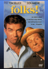 The DVD cover of Folks! DVD (1992) features two men—one younger with brown hair and one older wearing a hat—posing together against a blue background with bold yellow title text above. A must-have for collectors, this 1992 comedy film DVD captures the humorous spirit of Folks!.