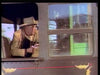 A person in a cowboy hat and tan jacket leans out of a train window with a revolver, evoking classic film scenes like those from "Rage at Dawn (1955) DVD," featuring dark green train panels and yellow details.