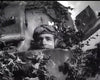 A soldier in goggles looks out from a camouflaged tank amid foliage, reminiscent of World War II scenes, as seen in "They Were Not Divided (1950)" DVD, with tank armor and markings visible behind him.