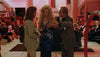 A scene in a red-lit room shows a woman in a sparkly blue dress with a suited man and another woman in a checked blazer—ideal for collectors of rare DVDs like "In the Arms of a Killer (1992) DVD.