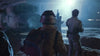 Three figures in futuristic uniforms stand on a muddy, smoky terrain near a damaged spaceship at night, bathed in blue-white light—a scene from Screamers (1995) DVD, evoking classic sci-fi film atmosphere.