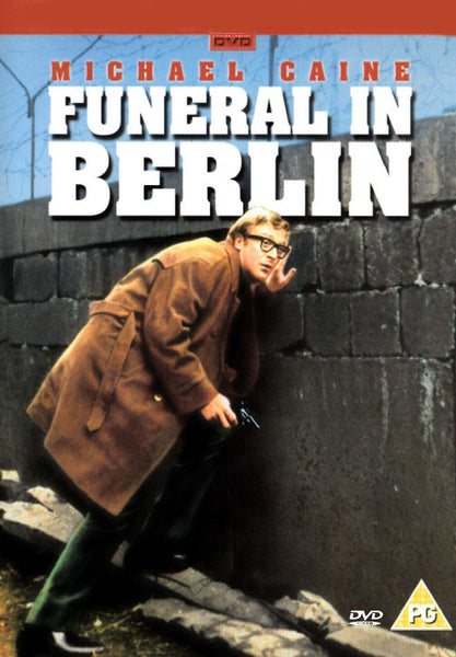 Funeral In Berlin DVD (1966) features an iconic cover with a man in glasses and a brown coat crouching by a concrete wall, gun in hand, with Michael Caine and the movie title displayed above—a must-have addition for collectors of classic films on DVD.