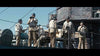 A group of uniformed sailors stands on a ship’s deck under a clear sky, some with life vests and hats, one using binoculars—reminiscent of scenes from classic naval movies like Godzilla Minus One (2023) DVD.