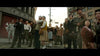 A diverse group gazes upward in shock on a city street—a scene echoing the dramatic vintage style found in Godzilla Minus One (2023) DVD.