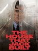A man in glasses and a suit stands behind foggy, blood-smeared glass. THE HOUSE THAT JACK BUILT (2018) DVD is now available, offering the psychological horror film as a rare collectible.