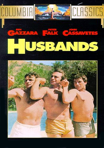 Three men in swim trunks stand side by side outdoors, flexing their arms and smiling. Above them, the text “Husbands” appears alongside the names of Ben Gazzara, Peter Falk, and John Cassavetes. This iconic image captures a memorable scene from *Husbands DVD (1970)*—a must-have for classic movie fans and collectors seeking this rare collaboration of legendary actors on DVD.