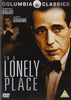 DVD cover for In A Lonely Place (1950) DVD shows a man in a suit and bowtie close-up, with a woman behind him. The title and actors' names stand out—perfect for fans of classic films on DVD.