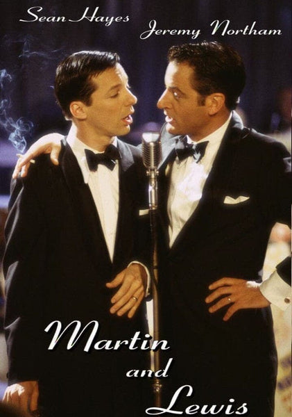 Sean Hayes and Jeremy Northam, dressed in tuxedos as Dean Martin and Jerry Lewis, sing into a vintage microphone on stage. The image features the Martin & Lewis (2002) DVD title.