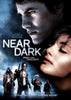 Near Dark (1987) DVD features the iconic movie poster from Kathryn Bigelow’s cult 1980s horror film, depicting two faces close together at the top and four individuals—some armed—standing below against a moody, dark backdrop with the tagline “Pray for Daylight.” This rare DVD is a must-have for collectors of hard-to-find horror movies.