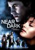 DVD cover art for Near Dark (1987) featuring a close-up of a man with glowing eyes looking over a woman, with four figures in a desert landscape below and the title Near Dark in the center.
