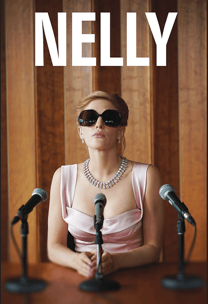 A woman in a pink dress and sunglasses sits at a table with two microphones, hands clasped, against a wooden background. "NELLY" appears above her—biographical drama Nelly (2016) now available on DVD.