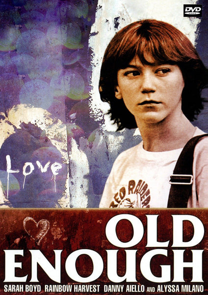 A young girl with short brown hair stands by a graffiti wall reading Love and a heart—Old Enough DVD (1984) is a Brooklyn 1980s coming-of-age film starring Sarah Boyd, Rainbow Harvest, Danny Aiello, and Alyssa Milano.