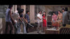 A group of men, some armed, confront a woman in red and others inside a contemporary room with stone walls, plants, and stylish furnishings. The tension evokes the atmosphere of classic cult cinema in this scene from “Oily Maniac (1976) DVD,” making it an essential addition for collectors of Hong Kong horror films.