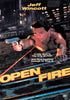 A muscular man with a gun crawls along a city street at night, neon lights and towering skyscrapers looming in the background. Text reads: Jeff Wincott stars in Open Fire DVD (1994)—A city held in the grip of fear, and a must-have for every action film collection.