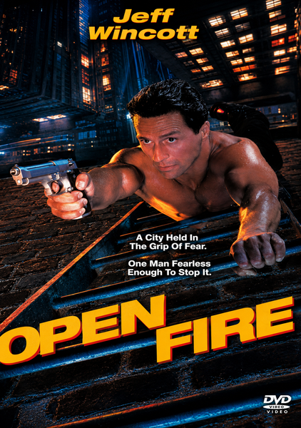 A muscular man in black pants aims a gun while lying on a city street grate at night. The cover features the text “Jeff Wincott” and “Open Fire,” highlighting taglines about a fearless hero saving a city gripped by fear. The Open Fire DVD (1994) is a rare and hard-to-find action film on DVD, making it an excellent choice for collectors and fans of intense urban thrillers.