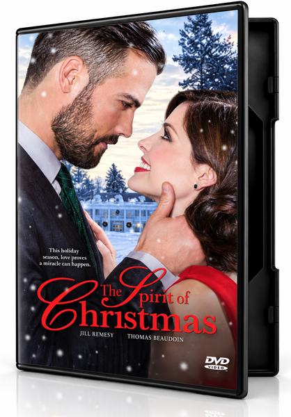 The cover of The Spirit of Christmas (2015) DVD features a man in a suit and a woman in a red dress gazing at each other in front of a snow-covered building.