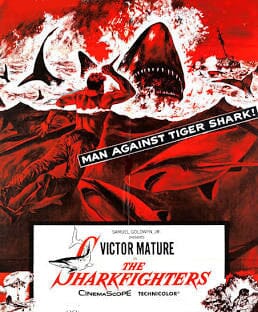 A striking red and black movie poster features a man battling a giant shark in stormy seas with the words “MAN AGAINST TIGER SHARK!” and “The Sharkfighters.” Get this classic on The Sharkfighters (1956) DVD.