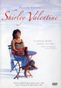 On the cover of the Shirley Valentine DVD (1989), a woman in a polka dot dress sits alone at a small seaside table, capturing the yearning of a Liverpool housewife; review quotes and award mentions highlight this cherished gem as one of cinema’s rare treasures.