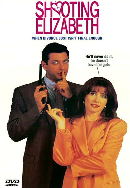 A man in a suit holds a gun and gestures for silence while a woman in a peach jacket points at him. Above them, the text reads “Shooting Elizabeth” and “When divorce just isn’t final enough.” A speech bubble says, “He’ll never do it, he doesn’t have the guts.” Shooting Elizabeth DVD (1992) is a witty Jeff Goldblum movie that’s a must-have for fans of classic films on DVD.