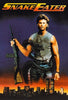 A muscular man with a rifle and a large snake wrapped around him stands before a sunset city skyline. The words SNAKE EATER appear above—get the classic 1989 military action film on Snake Eater (1989) DVD now.