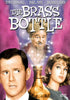 DVD cover for The Brass Bottle DVD (1964) featuring a concerned man, a woman, and a cheerful man in a turban rising from an illuminated brass bottle, with the movie title and actors’ names displayed above—a must-have for classic movie enthusiasts and collectors of films starring icons such as Barbara Eden.