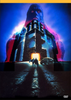 Two figures approach a glowing castle door under the cover of night, with a car parked close by. Above the castle, an enormous and ominous face, rendered in blue and purple tones, looms menacingly—channeling the mysterious allure of cult classic horror. This captivating scene evokes the atmosphere found in rare, hard-to-find movies like The Keep DVD (1983).