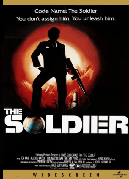 A silhouetted man with a gun stands before a fiery explosion on the movie poster for The Soldier DVD (1982), with the tagline, “You don’t assign him. You unleash him,” and bold white title text below. Perfect for collectors of hard-to-find movies or those seeking classic films on DVD, this action-packed release is a must-have addition to any rare movies on DVD collection.
