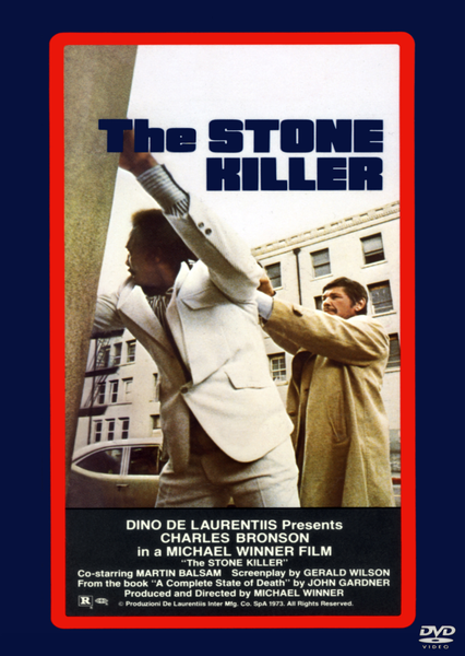 A movie poster for The Stone Killer DVD (1973) features a man in a tan suit holding a gun behind another man with a city backdrop. Starring Charles Bronson and directed by Michael Winner, this thrilling film is an essential addition to any classic movie collection on DVD.