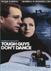 The DVD cover for Tough Guys Don't Dance (1987) features close-up images of a man and woman, rolling ocean waves, and a smaller scene with a man leaning on a car. The tagline reads, "A story of how dangerous love can be." This is one of those hard-to-find movies that stands out among classic films available on DVD.