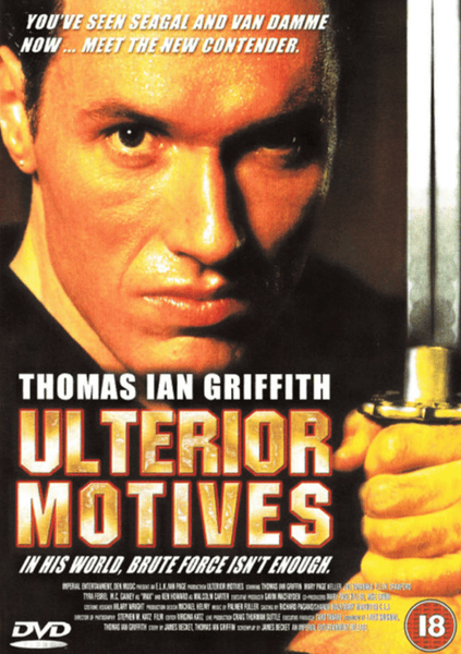 On the Ulterior Motives DVD (1992) cover, a man grips a sword near his face, channeling the suspense of a classic samurai film. The artwork features bold red and gold text showcasing Thomas Ian Griffith and hinting at action-packed scenes, with an 18+ age restriction symbol in the corner—making this DVD a great find for collectors or fans of vintage action movies.