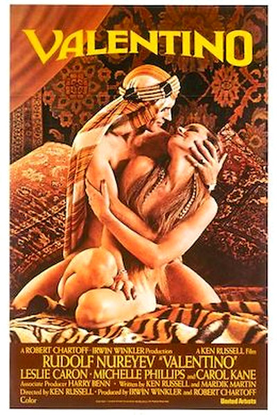 A man and woman, both draped in patterned headscarves and little else, share an intimate embrace and kiss atop a lavishly adorned carpet in this evocative artwork from Ken Russell’s film. The bottom of the image features the title “Valentino (1977) DVD,” along with cast and crew credits, perfectly capturing the allure of classic cinema brought to life on DVD.