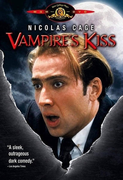 The cover of the Vampire’s Kiss (1989) DVD features a shocked man in a suit, set against a full moon backdrop, with a film review quote in the bottom left corner—making it an essential addition to any Nicolas Cage DVD collection.