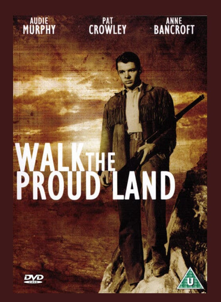 DVD cover for Walk the Proud Land DVD (1956) features a man in frontier clothing holding a rifle against a dramatic, cloudy sky. The names Audie Murphy, Pat Crowley, and Anne Bancroft are listed prominently at the top, emphasizing this unforgettable Western starring Audie Murphy. An essential addition to any classic movie DVD collection.