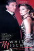 A man in a tuxedo and a woman in a gold dress stand together, with text reading "White Mischief: A True Story" and a tagline highlighting wife swapping, drugs, and murder. Centered on the intrigue of a British Empire murder case, this true crime drama unfolds on the White Mischief DVD (1987). The DVD logo is displayed at the bottom.