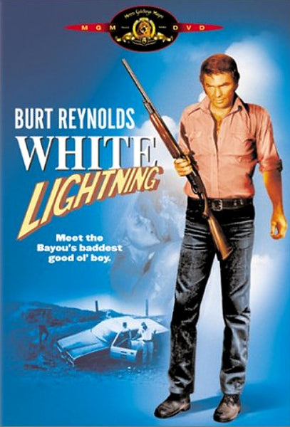Movie cover for White Lightning (1973) DVD: A man in a pink shirt with a shotgun stands before a crashed car and water. Text: Burt Reynolds White Lightning. Classic crime drama on DVD.
