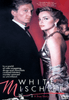 A man in a tuxedo and a woman in a glamorous dress pose against a red background on the cover of the White Mischief DVD (1987). The text highlights themes such as wife swapping, drugs, and murder, capturing the intrigue and decadence of British expatriate Kenya in this compelling true crime drama.