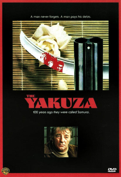 A movie poster for The Yakuza features a sword, gun barrels, and photos arranged on a bamboo mat. Text reads: "A man never forgets. A man pays his debts." At the bottom is the portrait of a man—an eye-catching image for film enthusiasts and collectors looking for The Yakuza DVD (1974) to add to their collection of classic movies on DVD.