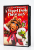 DVD case for A Muppet Family Christmas featuring Miss Piggy and Kermit the Frog in Santa-themed attire.