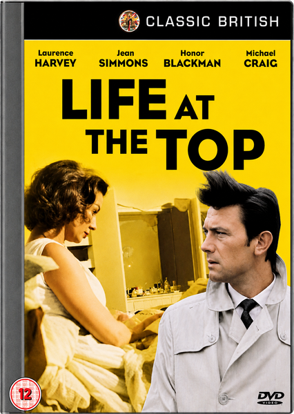 DVD cover for Life At The Top DVD (1965), the acclaimed sequel to Room at the Top, featuring a woman seated at a vanity and a man in a trench coat, set against a bold yellow background with the film’s title in large black letters. Cast names appear across the top of this Laurence Harvey movie collectible.