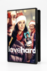 On the Love Hard (2021) DVD cover, a woman in a Santa hat holds a smartphone displaying a dating profile as two men stand behind her.