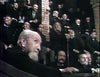 An older man with a white beard, resembling Jack Palance, sits in the foreground of The Strange Case of Dr. Jekyll and Mr. Hyde (1968) DVD, looking toward a large audience of men in suits gathered in a tiered lecture hall.